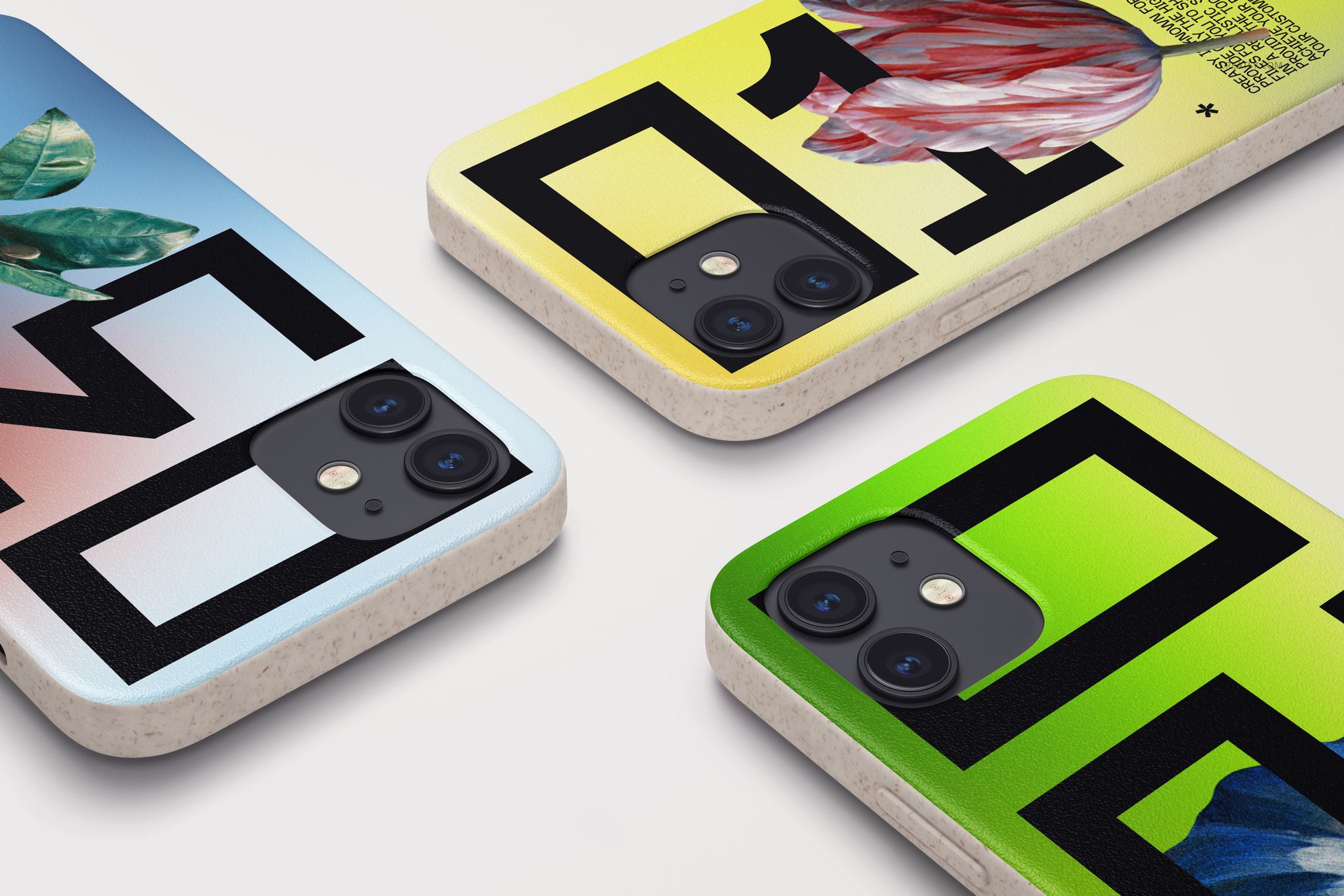 Diagonal view of iPhone 12 mockup cases with vibrant designs and dual camera cutouts on a light surface.