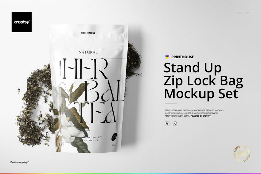Stand up zip lock bag mockup featuring a white pouch with bold black lettering, placed next to scattered tea leaves.