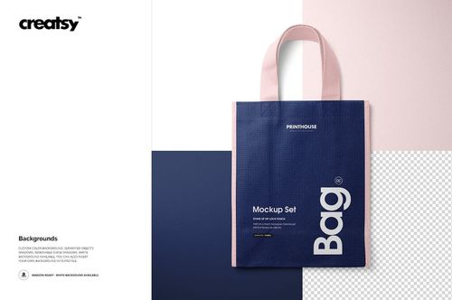 Front view of a non-woven tote bag mockup with navy blue body and light pink handles, set against a white background.