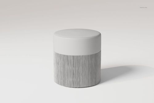 Round upholstered ottoman with a smooth white top and textured fringe base, shown in a minimalist setting, front view.