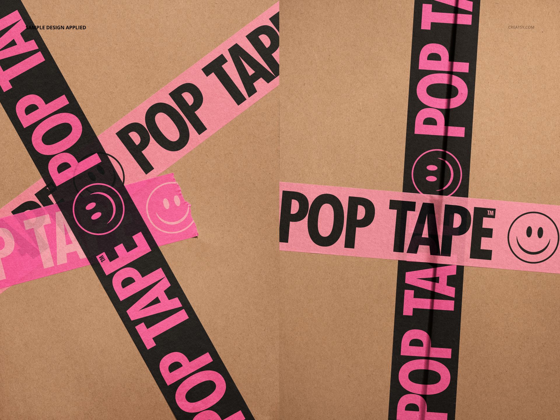 Closeup view of paper packaging tape mockup with pink and black tape strips featuring text and smiley face on cardboard.