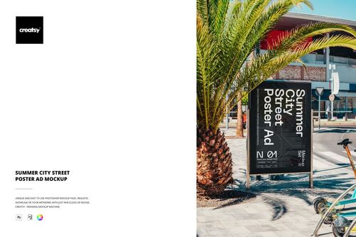 Outdoor city street scene featuring a vertical poster mockup on a sidewalk, with palm tree and modern building nearby.