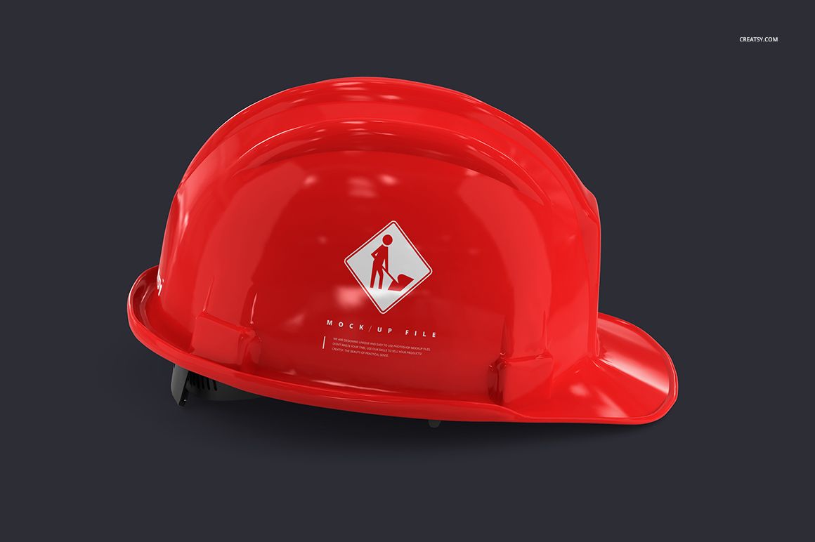 Red hard hat with a white construction sign graphic, shown in a side view on a dark background, PSD mockup.