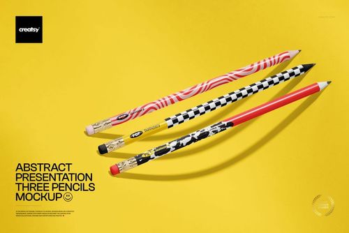 Three pencils with abstract patterns and bold colors arranged diagonally on a yellow background in a stationery mockup.