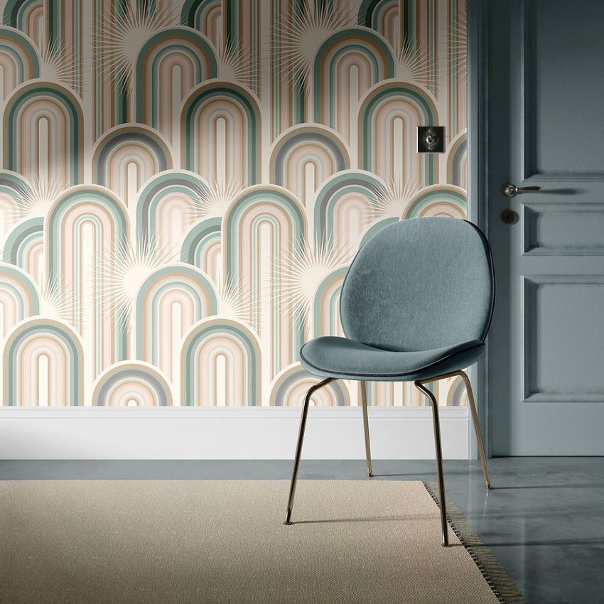 Interior scene mockup showing a modern chair with a blue cushion in front of a patterned wallpaper and a closed door.