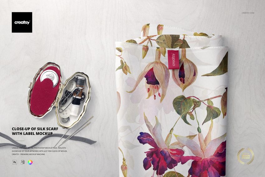 Close-up of a silk scarf mockup with a visible fabric label, featuring a floral pattern and soft colors.