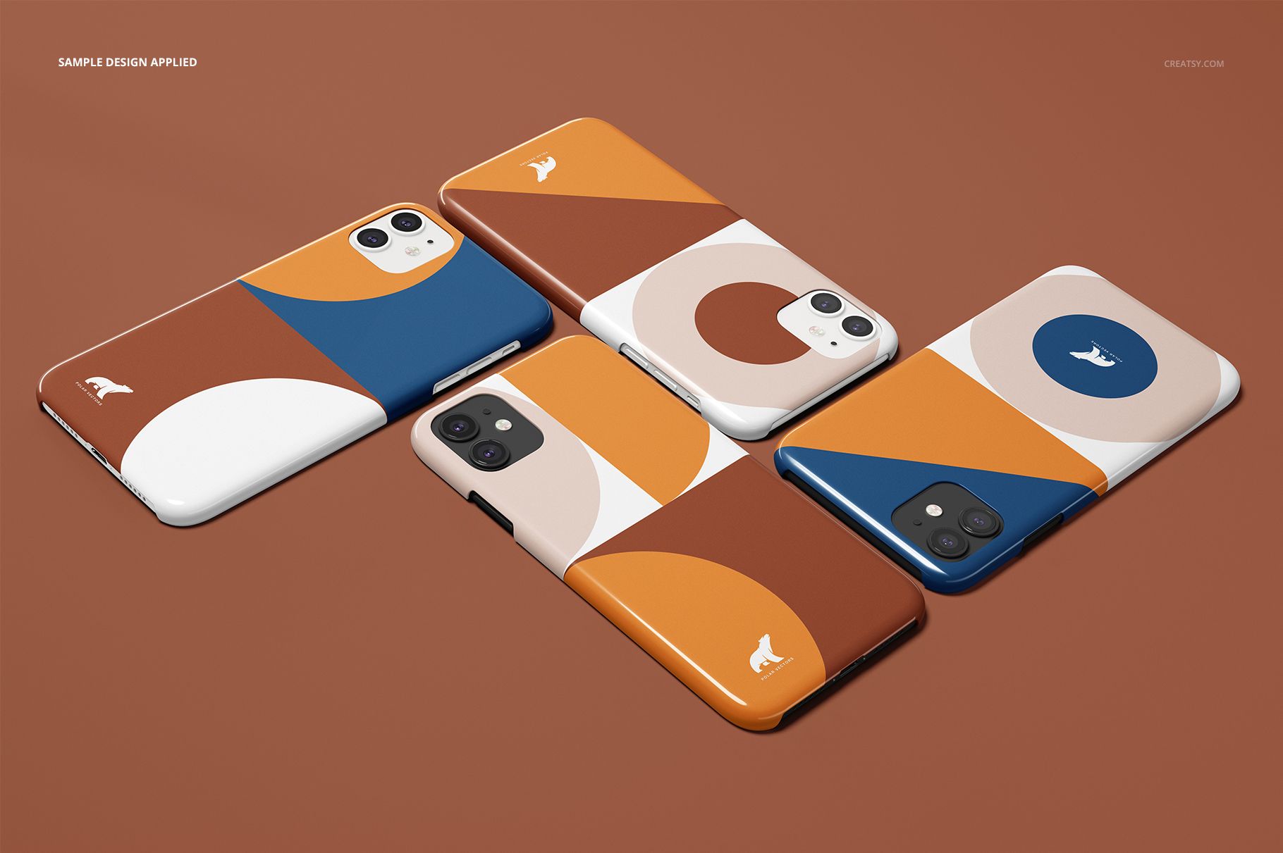 iPhone 11 glossy snap case mockup set showing abstract geometric designs in orange, blue, and beige on a brown background.