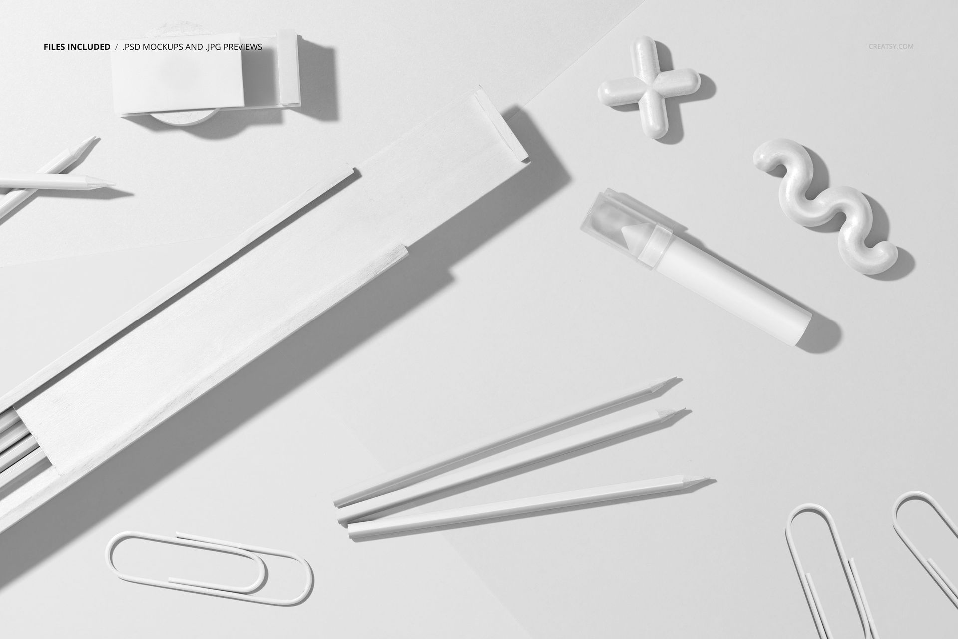 Flat lay of a wooden pencil box mockup, white pencils, paper sheets, and minimalistic office supplies in neutral tones.