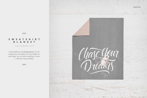 Gray crib bedding mockup with white script text and plush toy on a light wooden surface, top view.