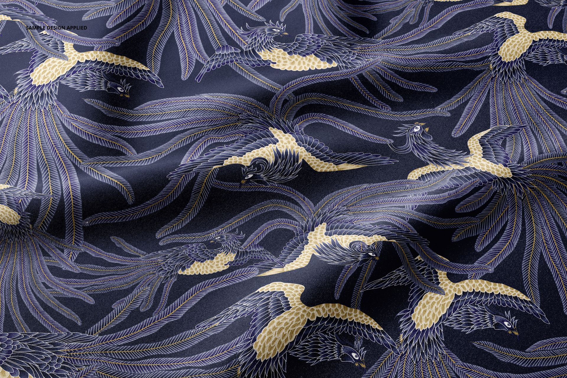 Scuba fabric mockup featuring a close-up view of dark textile with intricate golden and blue bird pattern design.