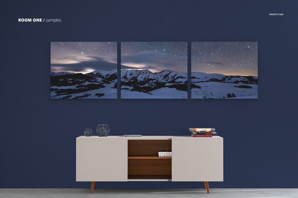 Three-piece canvas print mockup displayed above a white commode, featuring a night mountain scene with stars.