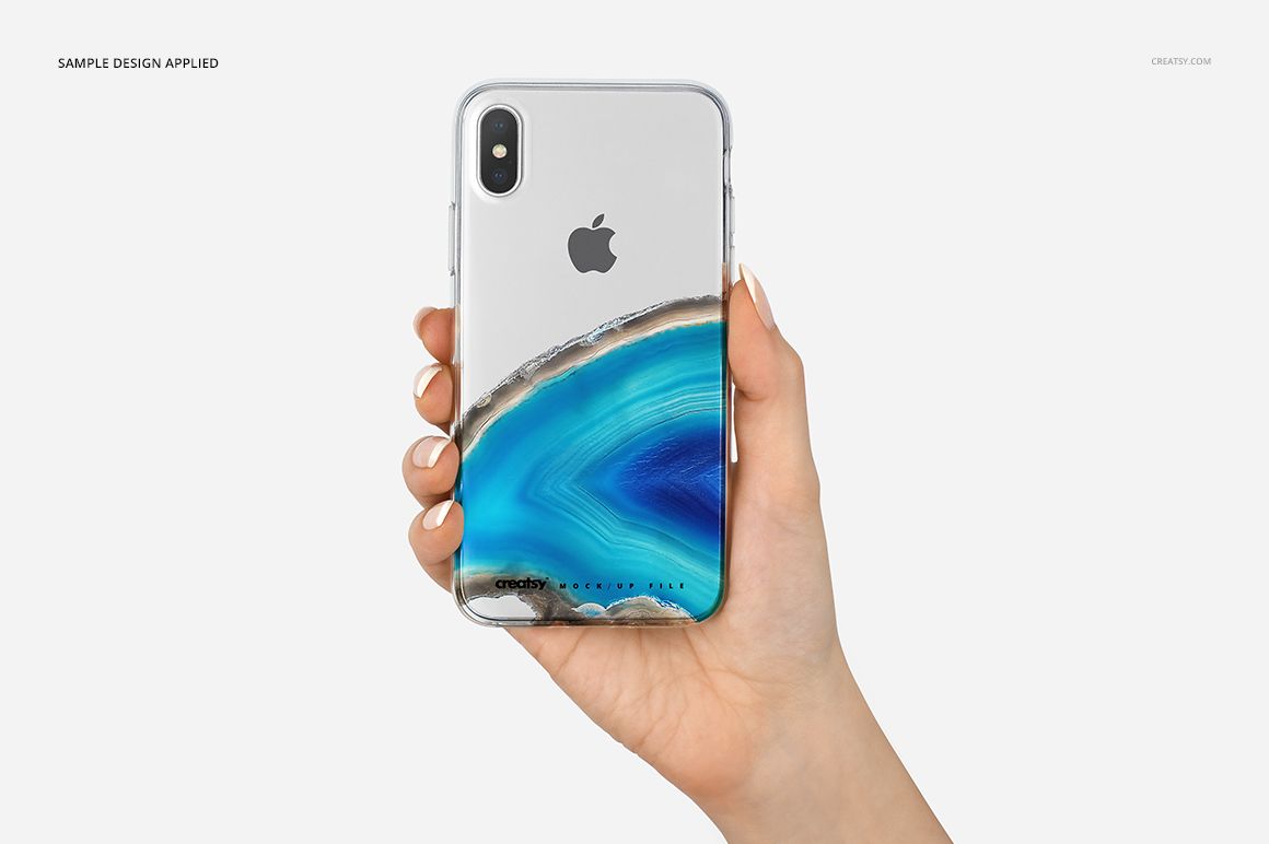 PSD mockup of a clear iPhone X case with blue mineral design, shown in a hand, front perspective, white background.