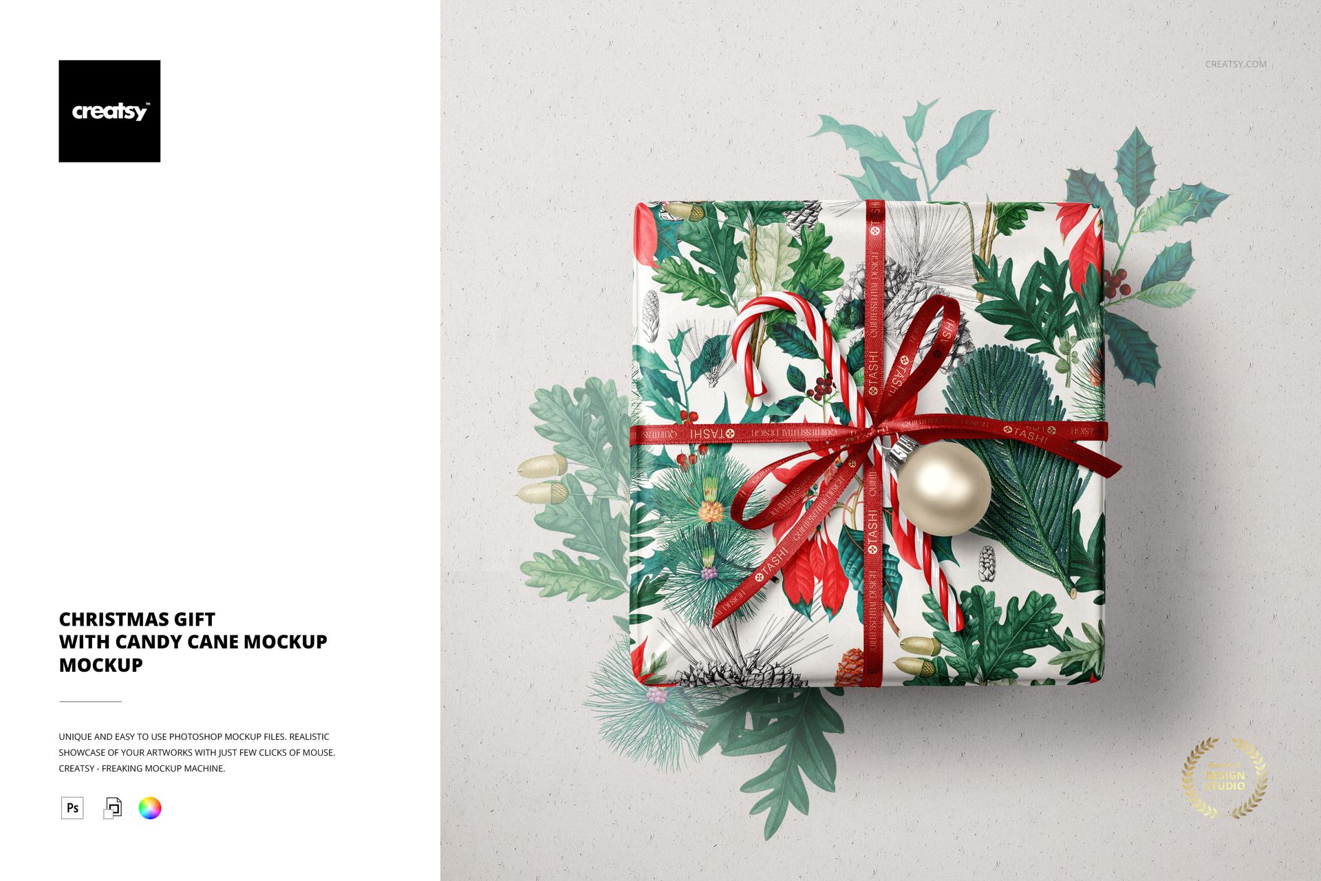 Square Christmas gift wrapped in festive patterned paper with red ribbon, candy cane, and bauble, top view mockup.