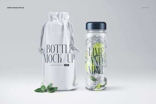 Front view of a transparent water bottle mockup with lime and mint inside, beside a fabric bag with printed text.