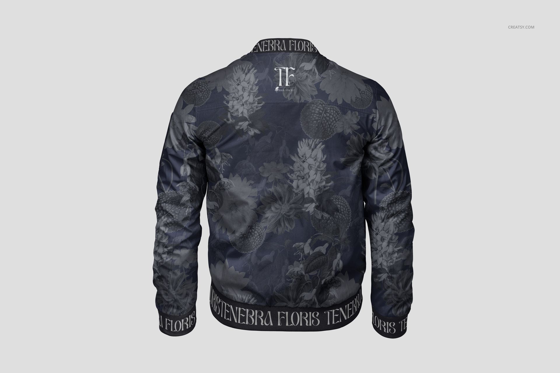 Back view of men's bomber jacket mockup with dark floral pattern, ribbed cuffs, and collar on a light background.