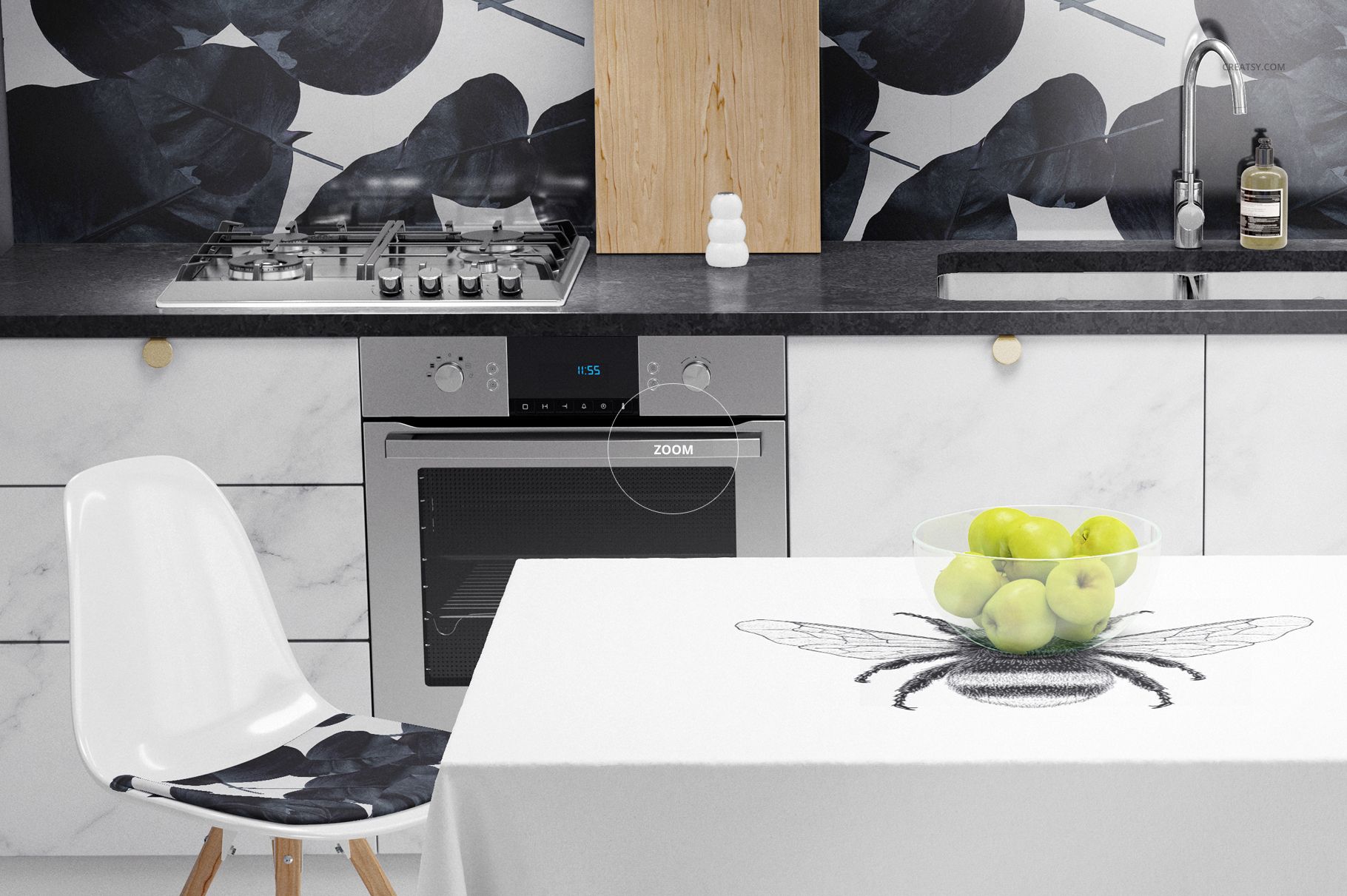 Modern kitchen scene with white marble cabinets, black countertop, and a table covered by a bee-patterned cloth mockup.