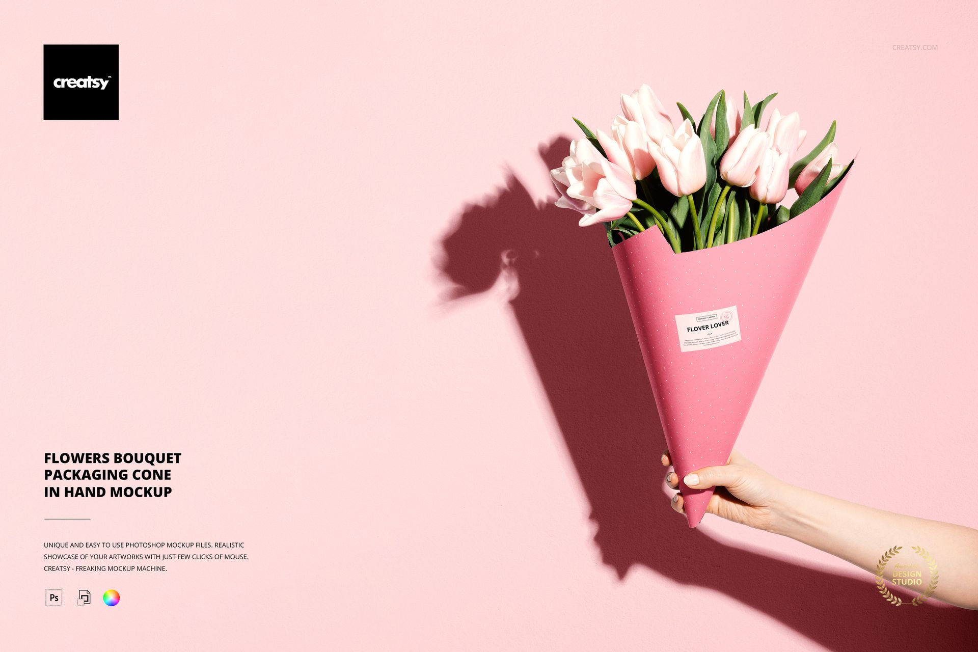 PSD mockup showing a person holding a pink floral cone with tulips, casting a shadow on a soft pink wall.