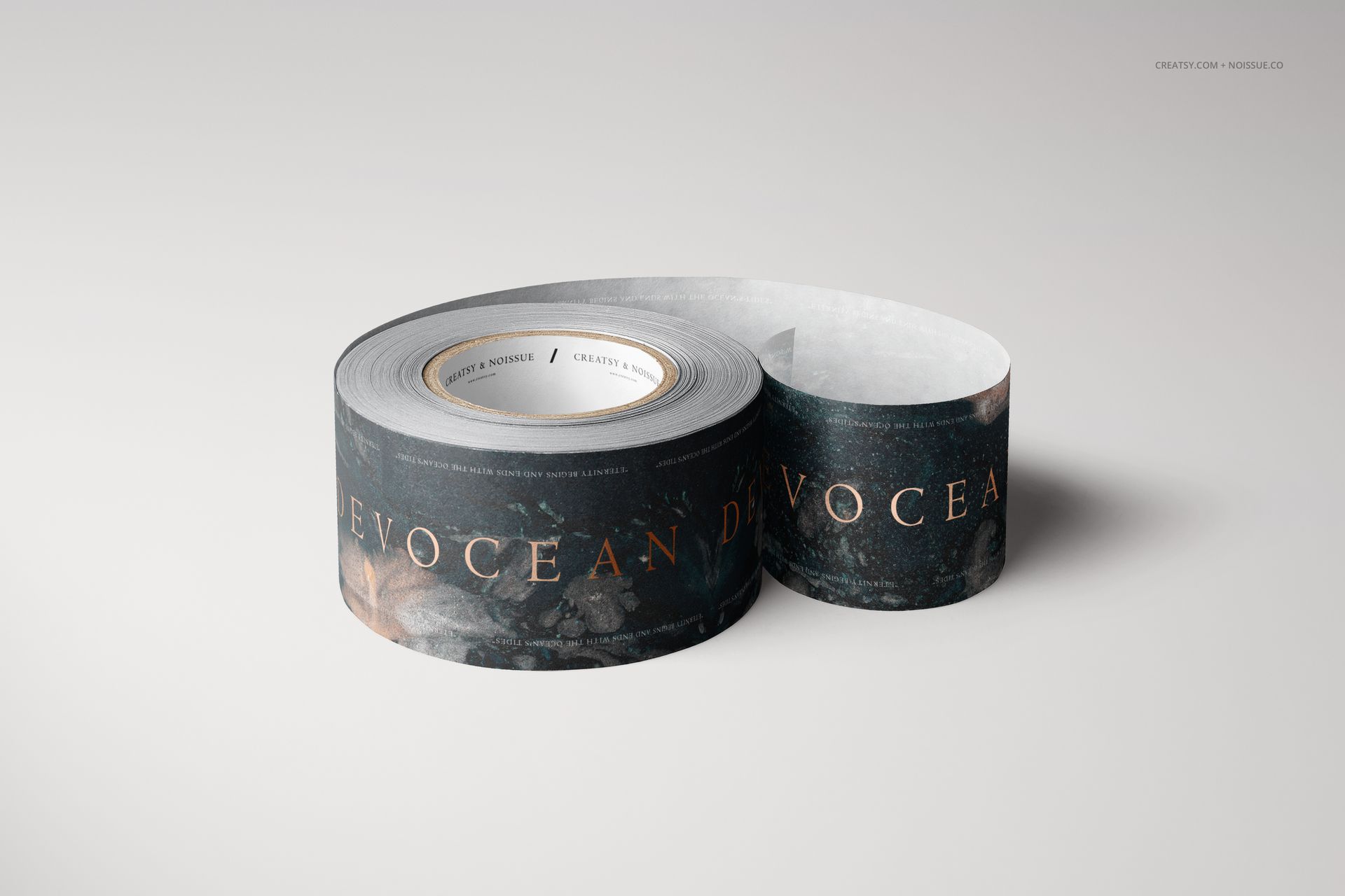 Two rolls of dark patterned mailing tape displayed on a light surface, shown from a front angle with visible text.