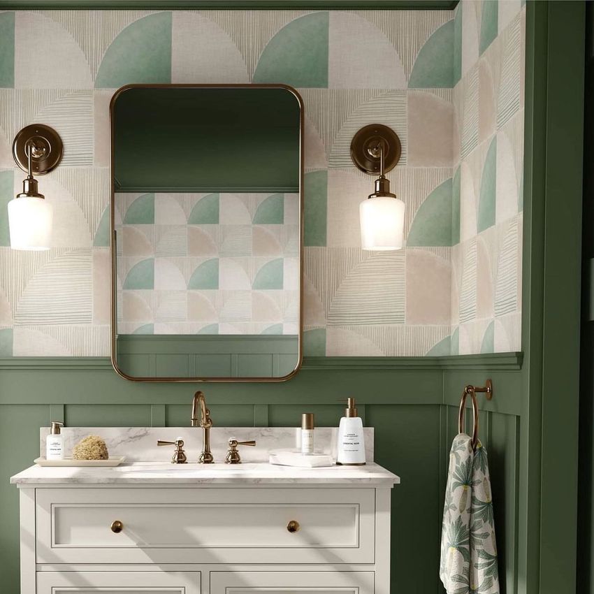 Bathroom mockup featuring a white vanity with marble countertop, brass fixtures, and geometric patterned wallpaper in soft pastel tones.