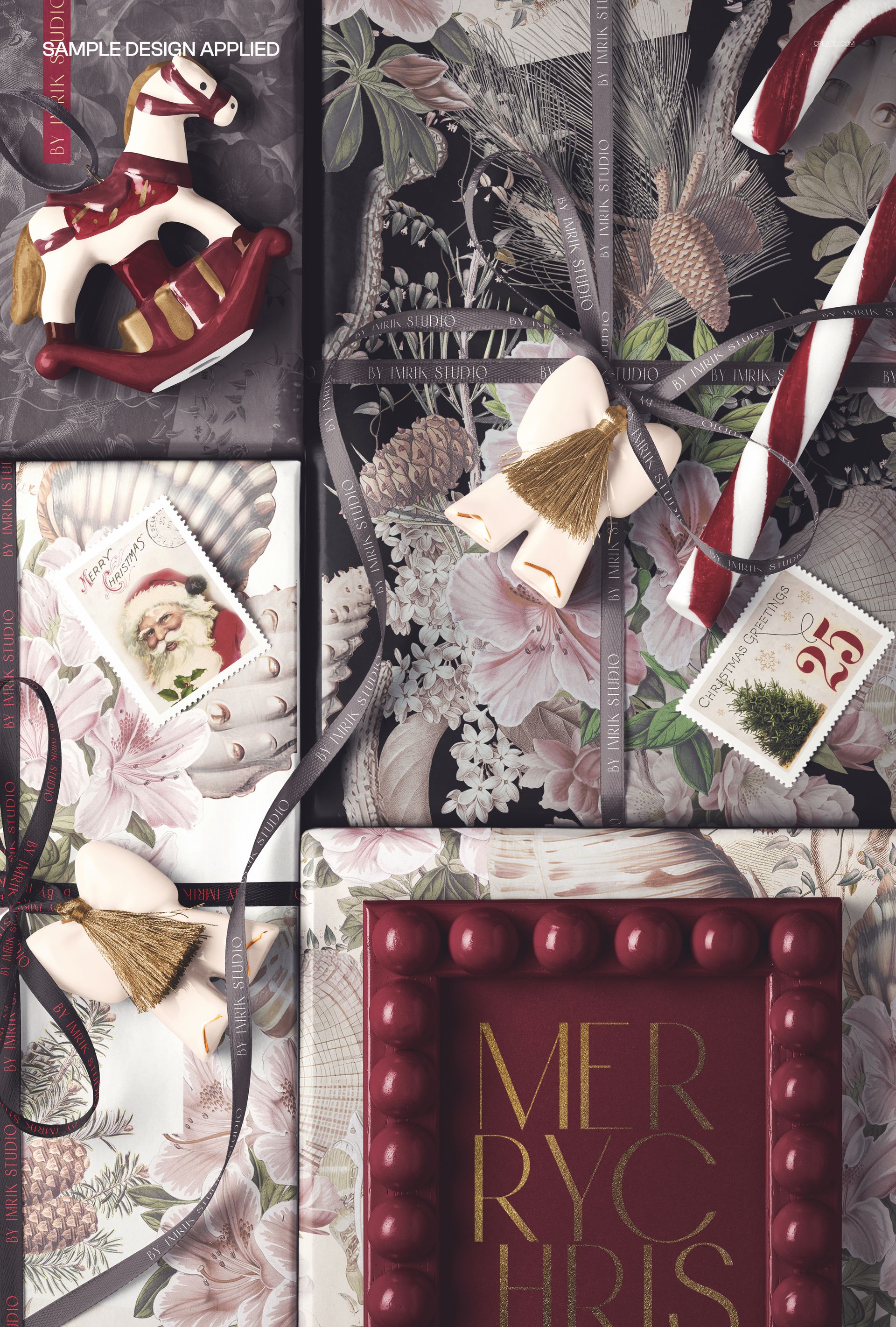 Christmas-themed PSD mockup showing assorted gift boxes with botanical prints, festive props, and ribbons from above.