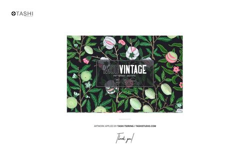 Front view of fabric rolls mockup featuring a dark background with colorful vintage fruit and floral patterns.