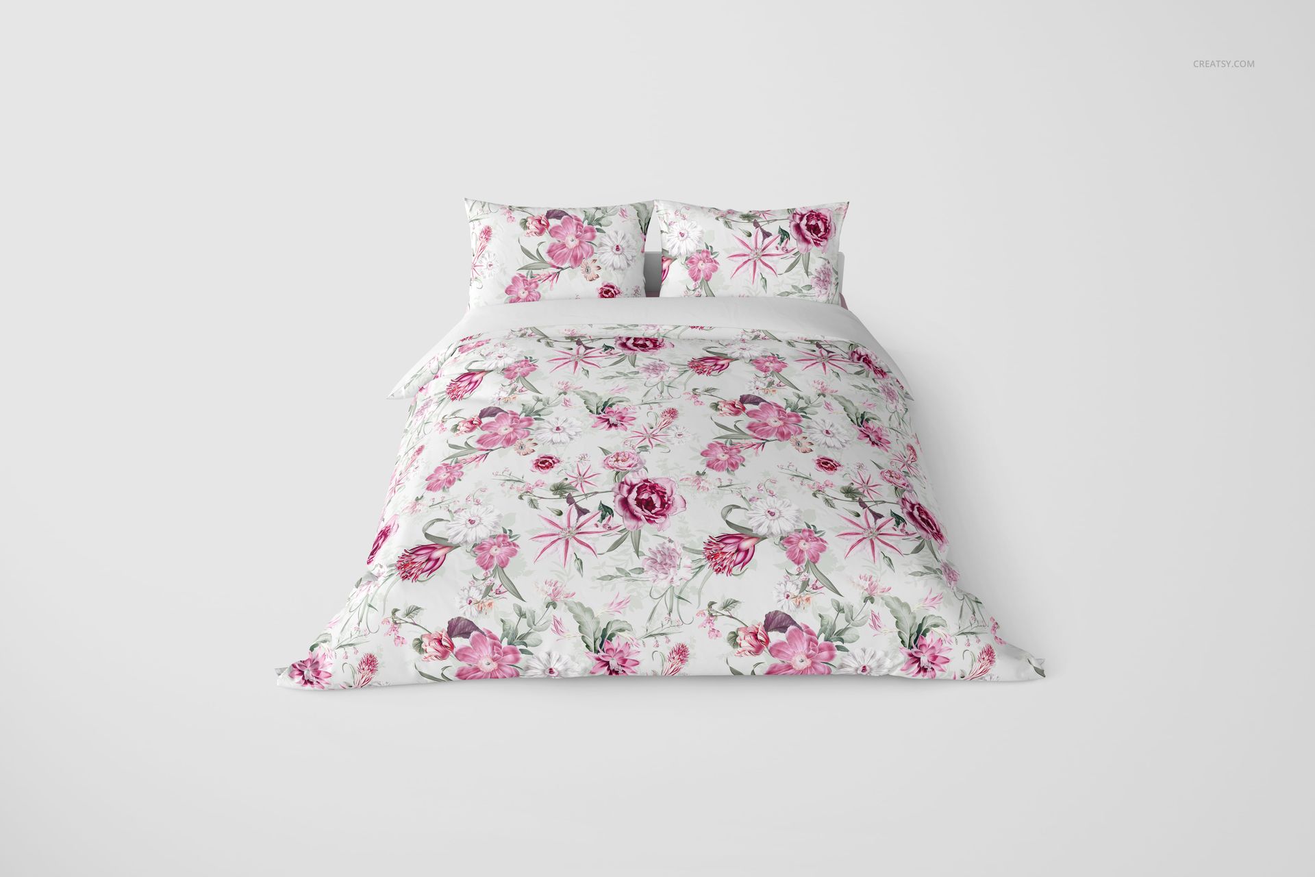 Front view of a bedding set mockup with a duvet and two pillows, featuring a pink floral pattern on white fabric.