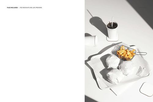 Front-facing scene showing a PSD mockup of burgers and fries wrapped in white paper on a tray with a drink cup.