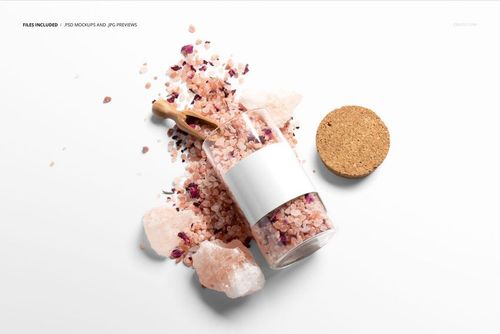 Bath salt mockup featuring a clear jar with a white label, scattered pink crystals, and a wooden scoop on white background.