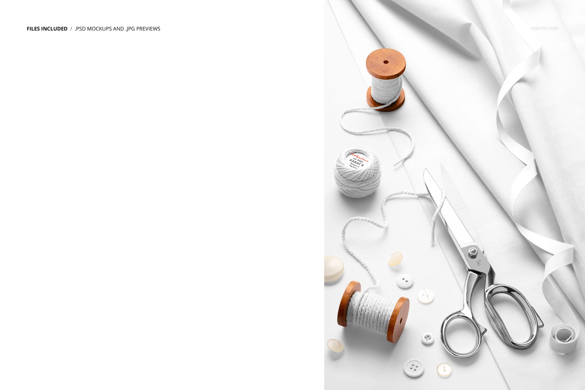 Top view of white cotton fabric mockup with sewing tools, including scissors, thread spools, and buttons on a white background.