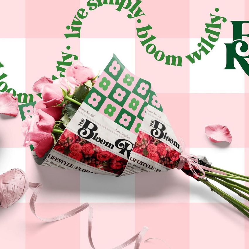Flower bouquet mockup with custom wrapping paper, pink rose petals, and curved green text overlay on a pastel checkered backdrop.