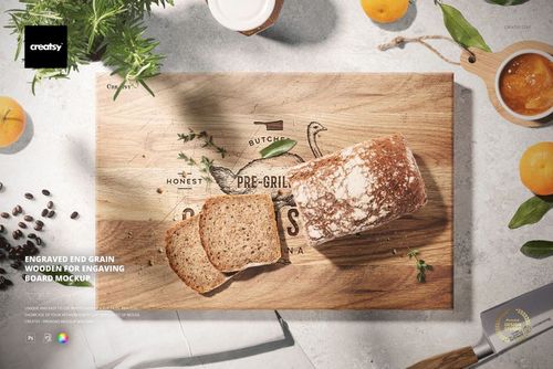 End grain wooden board mockup with bread slices on top, displayed with oranges, coffee beans, and kitchen utensils.