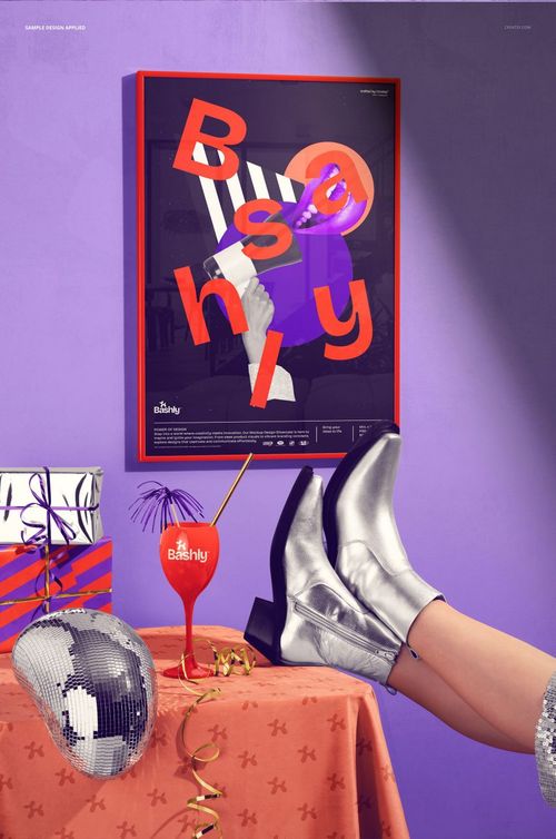 Party table with wrapped gifts, disco ball, and silver boots in front of a picture frame mockup on a purple wall.