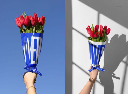Tulip bouquet wrapped in blue and white patterned paper, displayed outdoors and indoors in a PSD mockup scene.