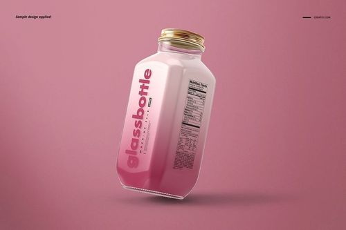 Glass bottle mockup with gold cap, featuring a pink label and nutrition facts, displayed on a pink background.