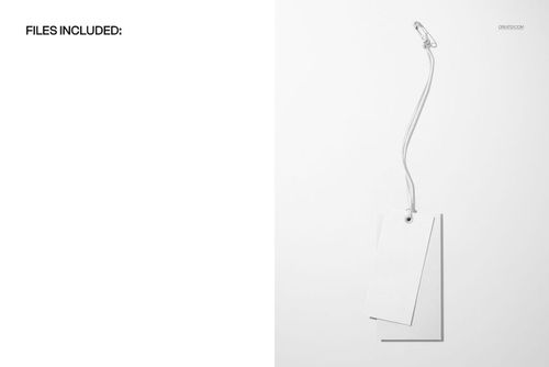 Minimalist mockup of two blank paper labels for clothing, connected by a white cord and safety pin, top view.