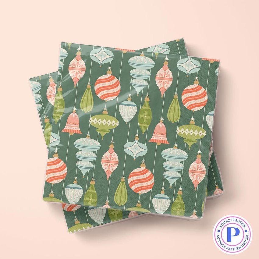 Napkins mockup featuring two stacked napkins with a retro Christmas ornament pattern in green, red, and white tones.