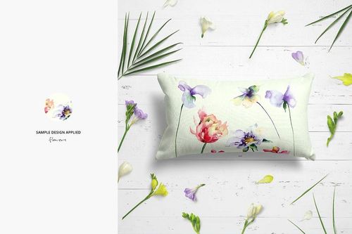 Top view of a rectangular pillow mockup featuring soft pastel flower designs, surrounded by scattered flowers and leaves.