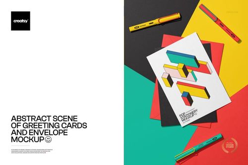 Abstract scene featuring greeting cards and an envelope mockup on colorful paper backgrounds with pens arranged nearby.