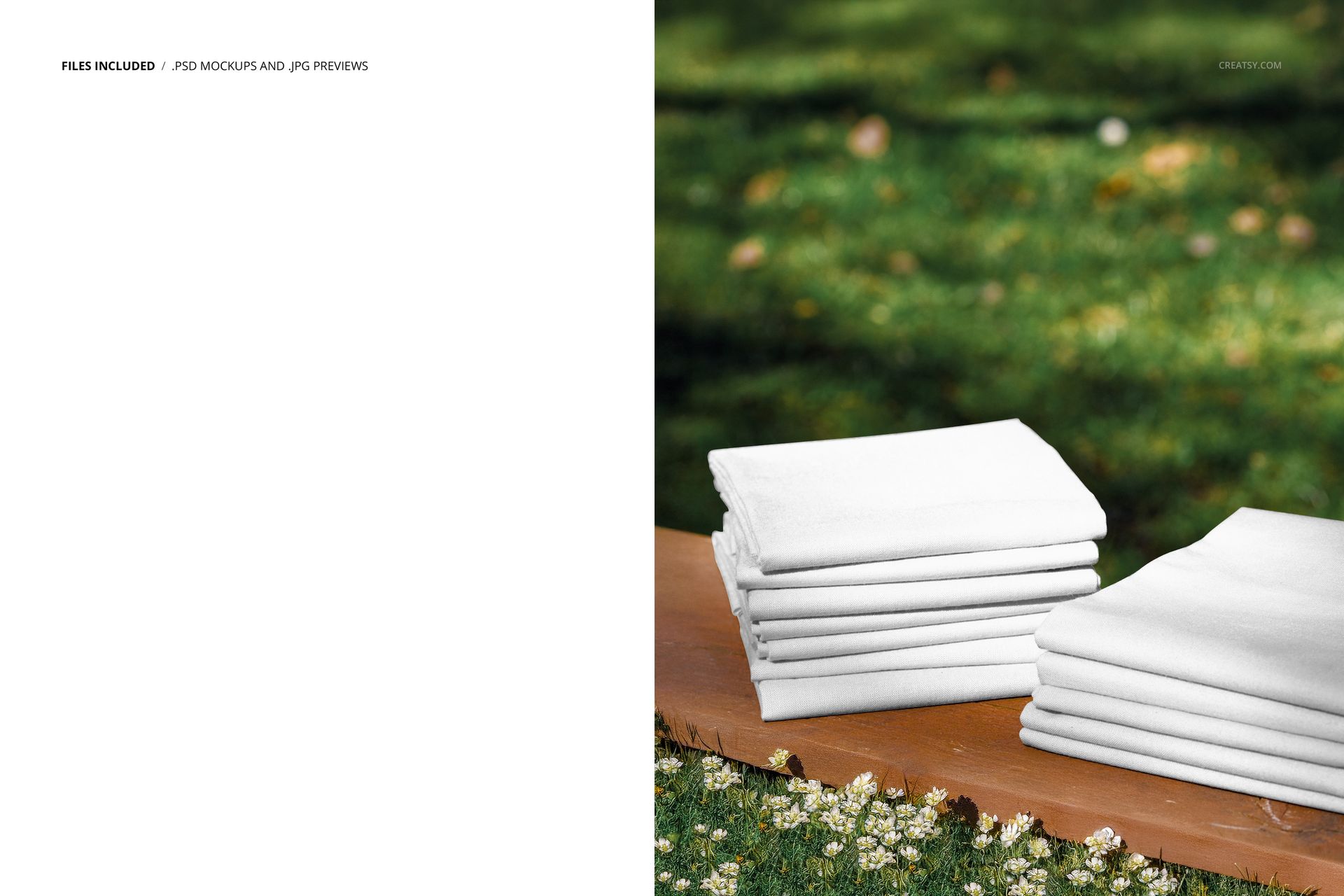 Stacked white fabrics placed on a wooden plank outdoors, with a green meadow and small flowers in the background.
