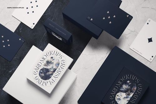 Playing cards and packaging mockup displayed on a marble surface, featuring navy and white color scheme.