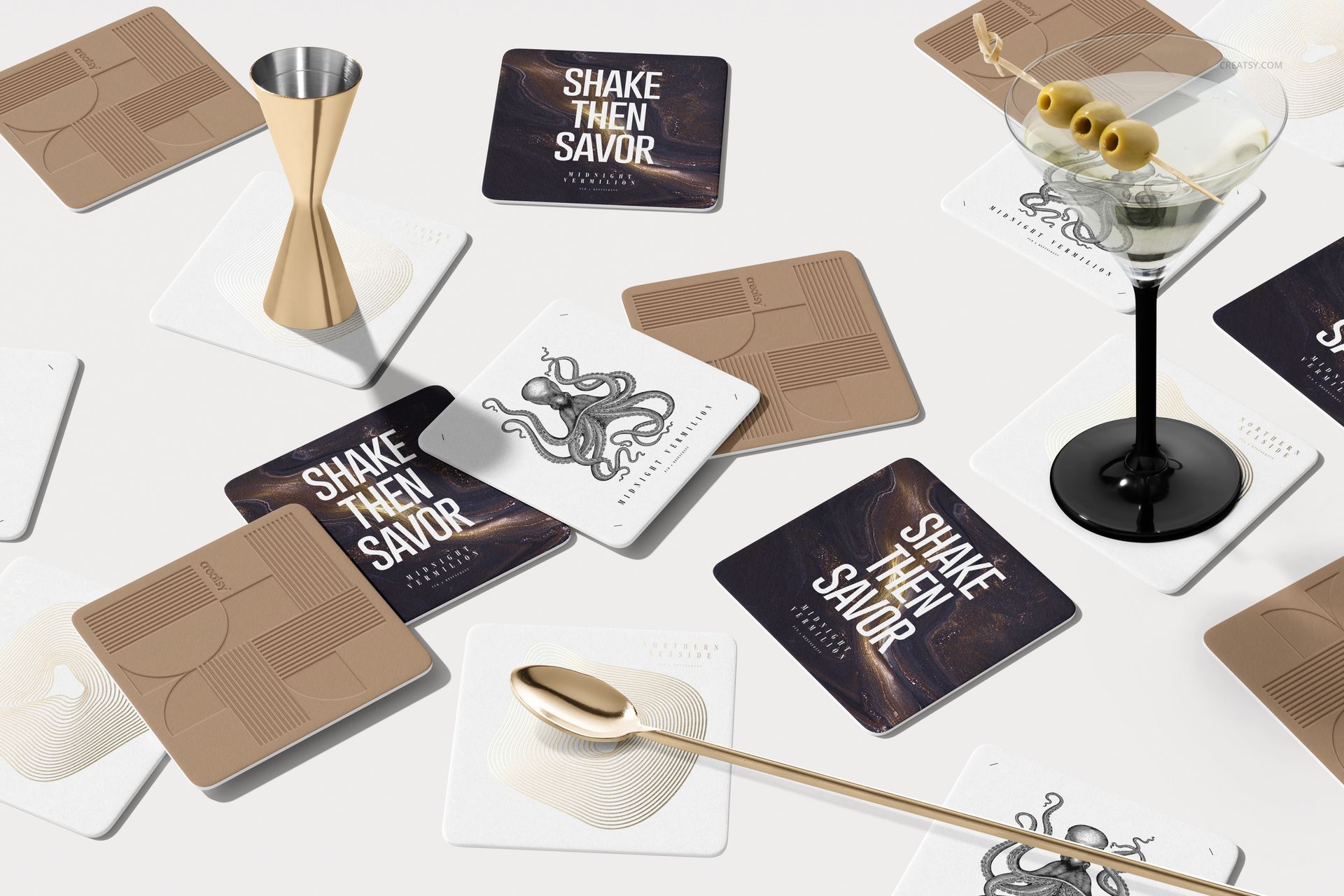 Square coasters arranged on a white surface, featuring abstract, text, and illustrated designs in neutral tones.
