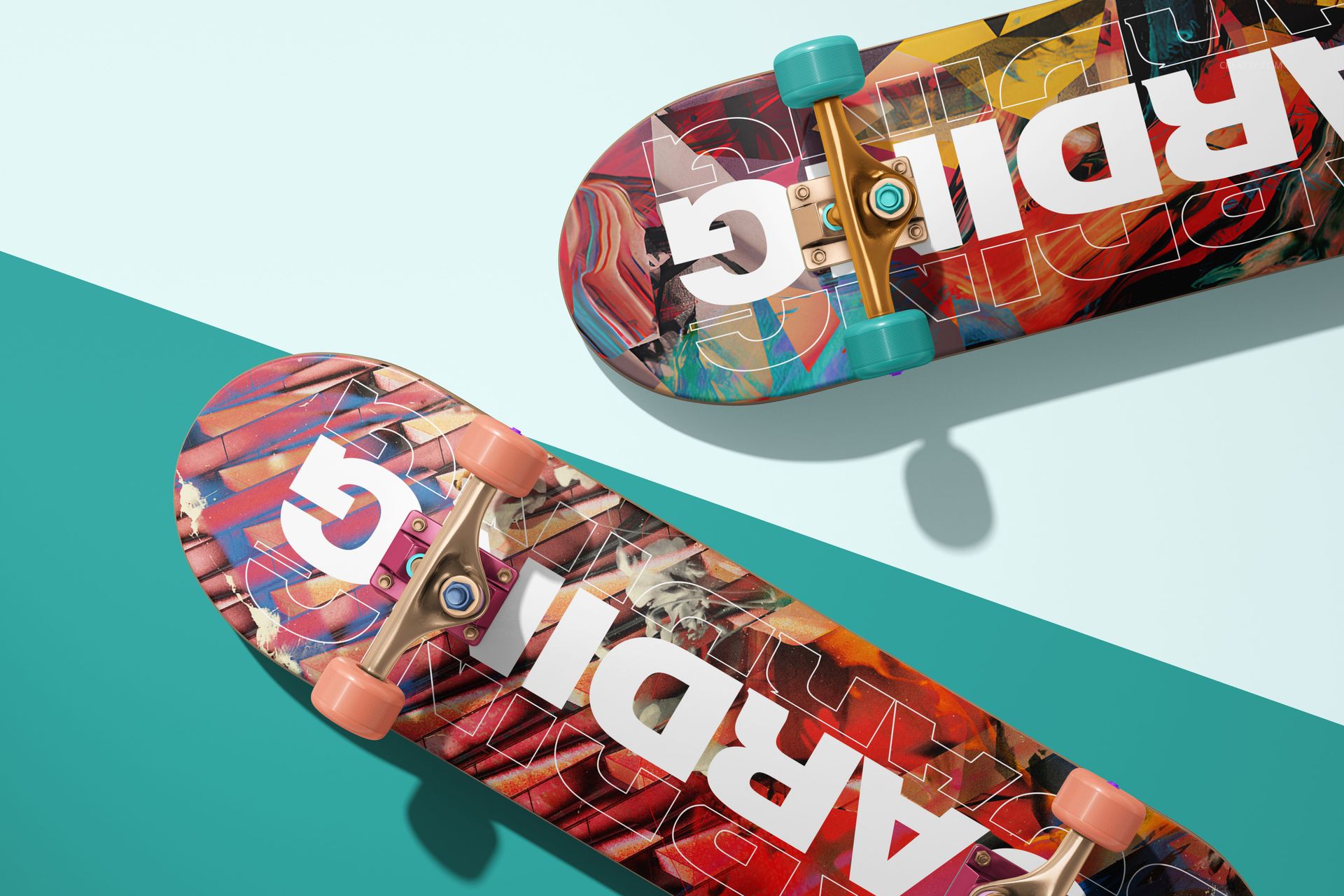 Skateboard deck PSD mockup set displaying dynamic patterns and large white text, photographed from above with teal accents.