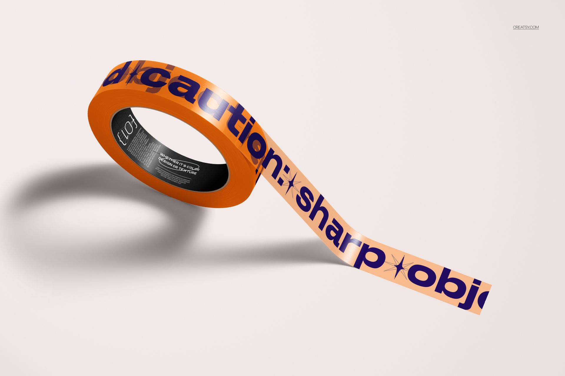 PSD mockup of a narrow, semi-transparent duct tape with orange and blue caution text, angled on a plain surface.