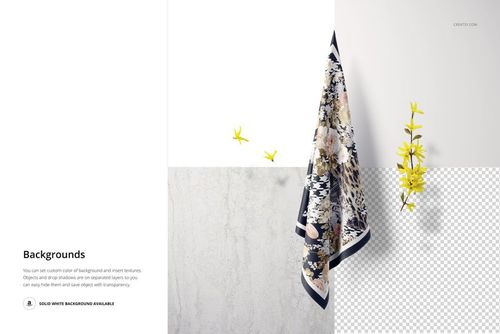 Hanging square silk scarf mockup with a decorative pattern, displayed on a textured wall with yellow flowers nearby.
