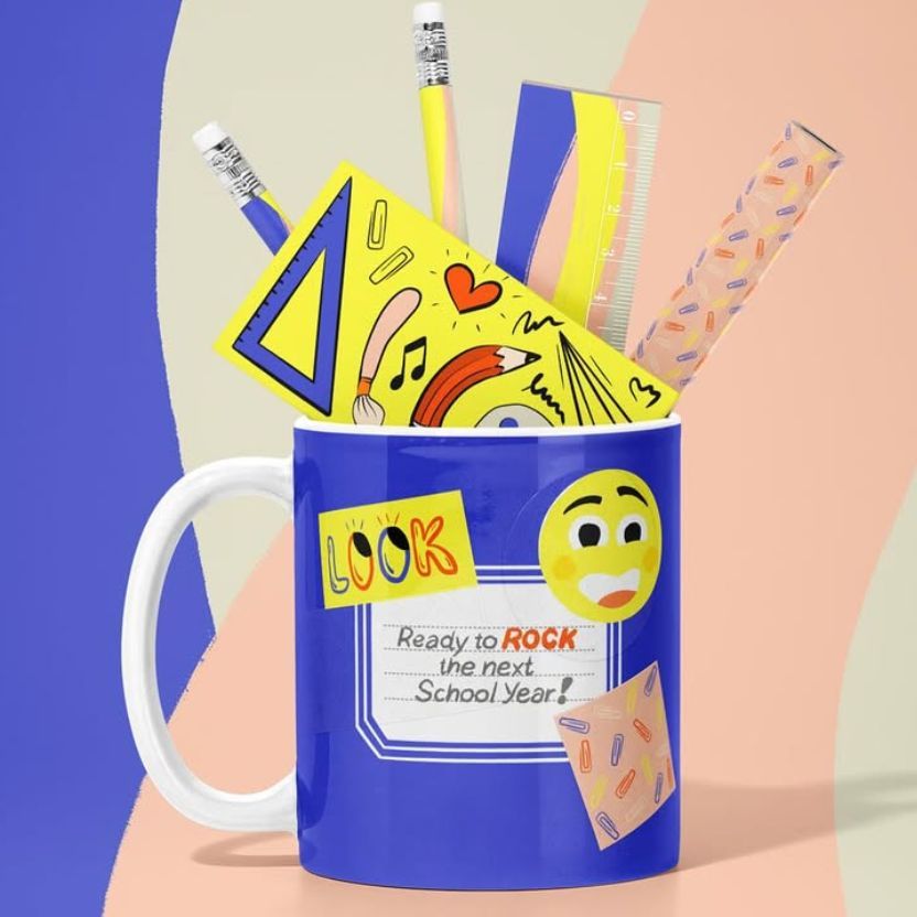 Mug mockup featuring a blue ceramic mug filled with office supplies like pencils, a ruler, and a notebook against a pastel background.