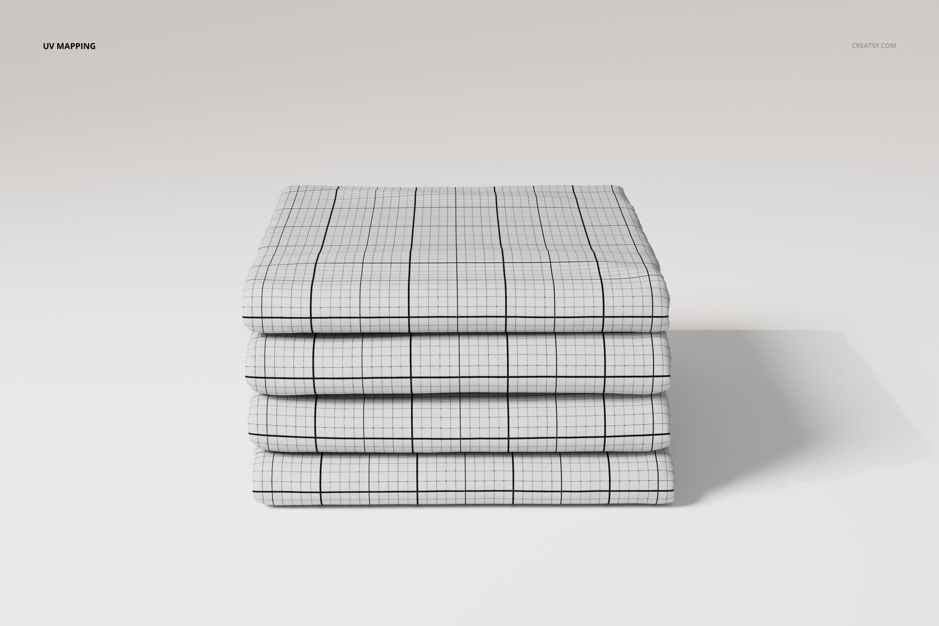 Folded cotton flat sheets stacked in a neat pile, featuring a white surface with a black grid pattern, front view.