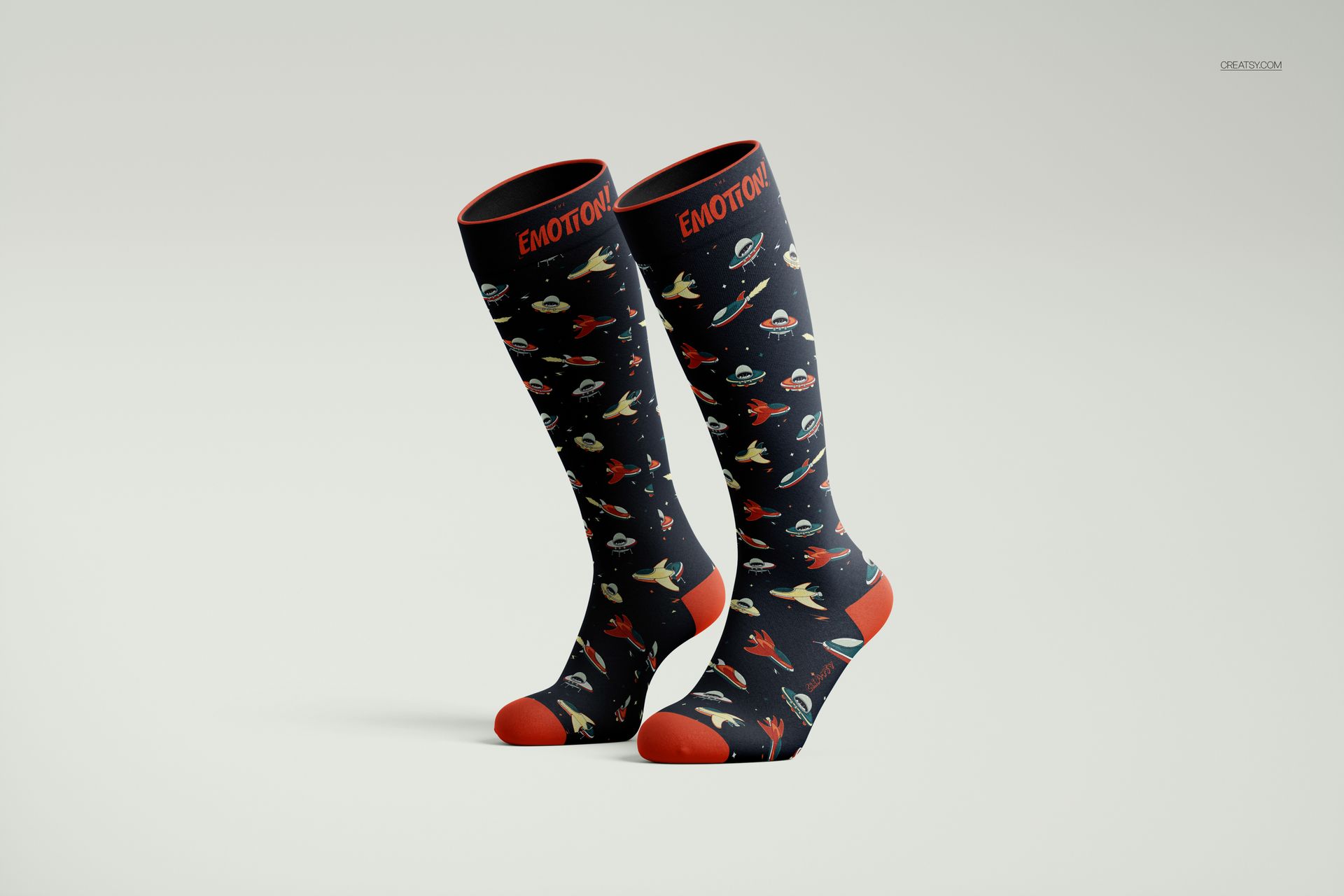 Over the calf socks mockup featuring a space-themed pattern with rockets and planets, shown in front view on a light background.