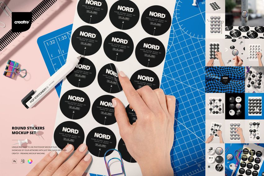 Round stickers mockup set displayed on a workspace with blue grid mat, ruler, pen, and colorful paper clips.