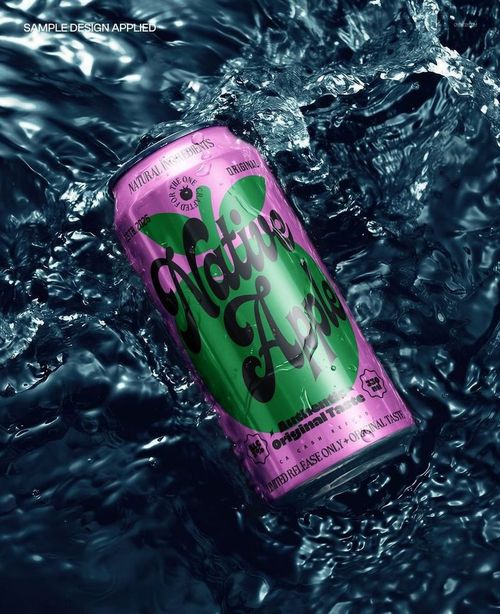 Metal drink can mockup with bold green and pink graphics, shown floating in deep blue waves from a front angle.