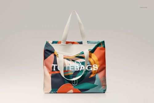 Front-facing PSD mockup of a spacious canvas tote bag with vibrant geometric design and white straps on neutral backdrop.